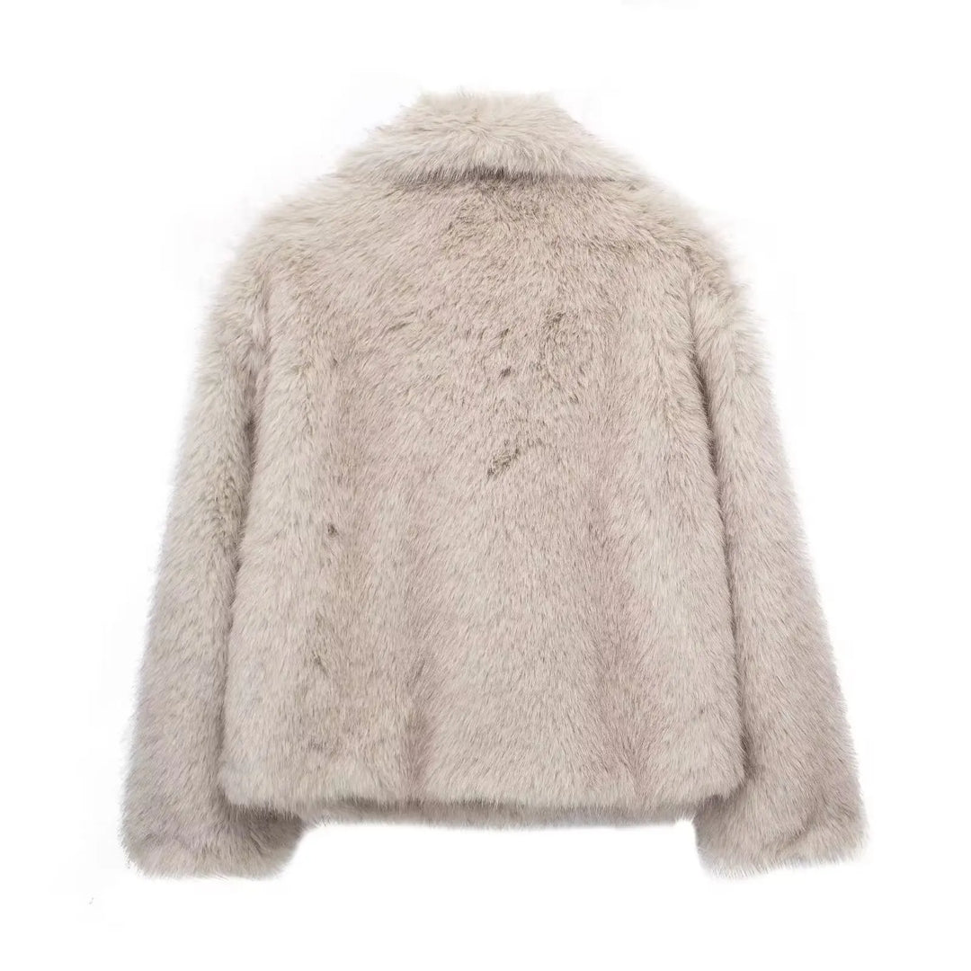 Beige fluffy jacket on a white background