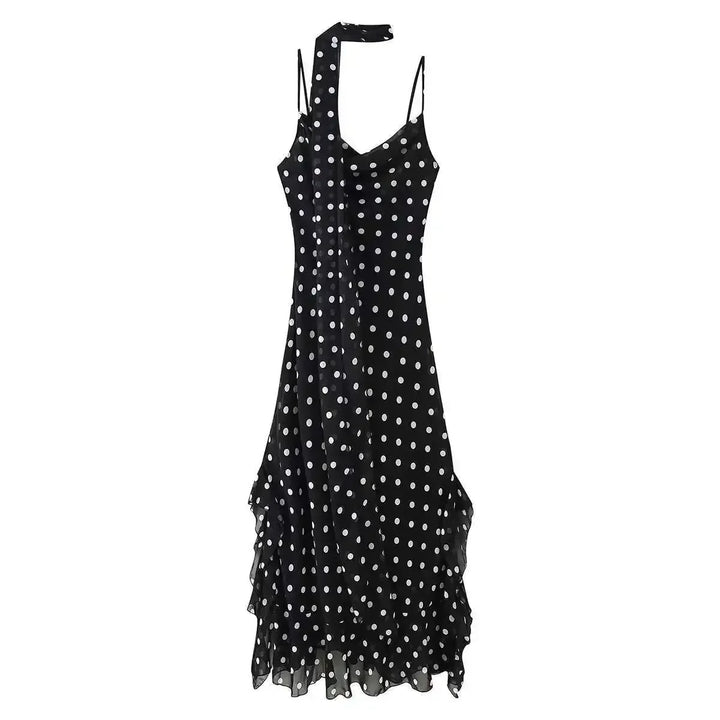 Black polka dot dress on a white background