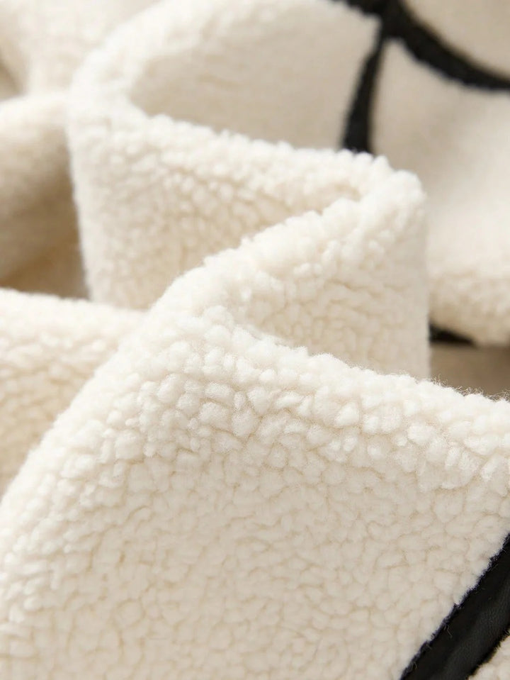 Close-up of textured white fabric with a blurred background